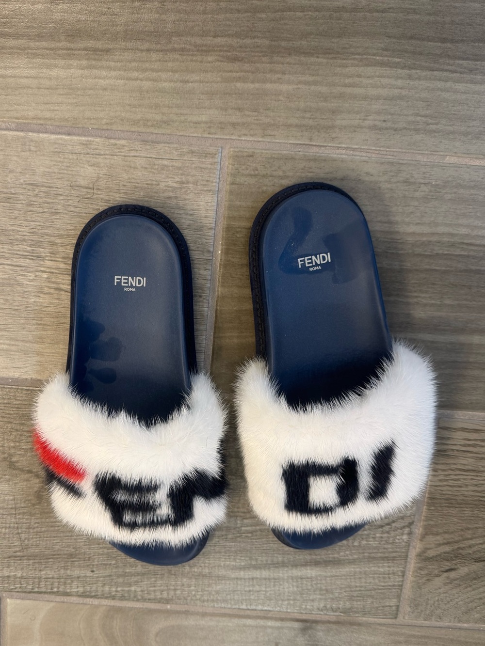 Fendi Navy Footbed White Fur Logo Slides with Red & Black Accents